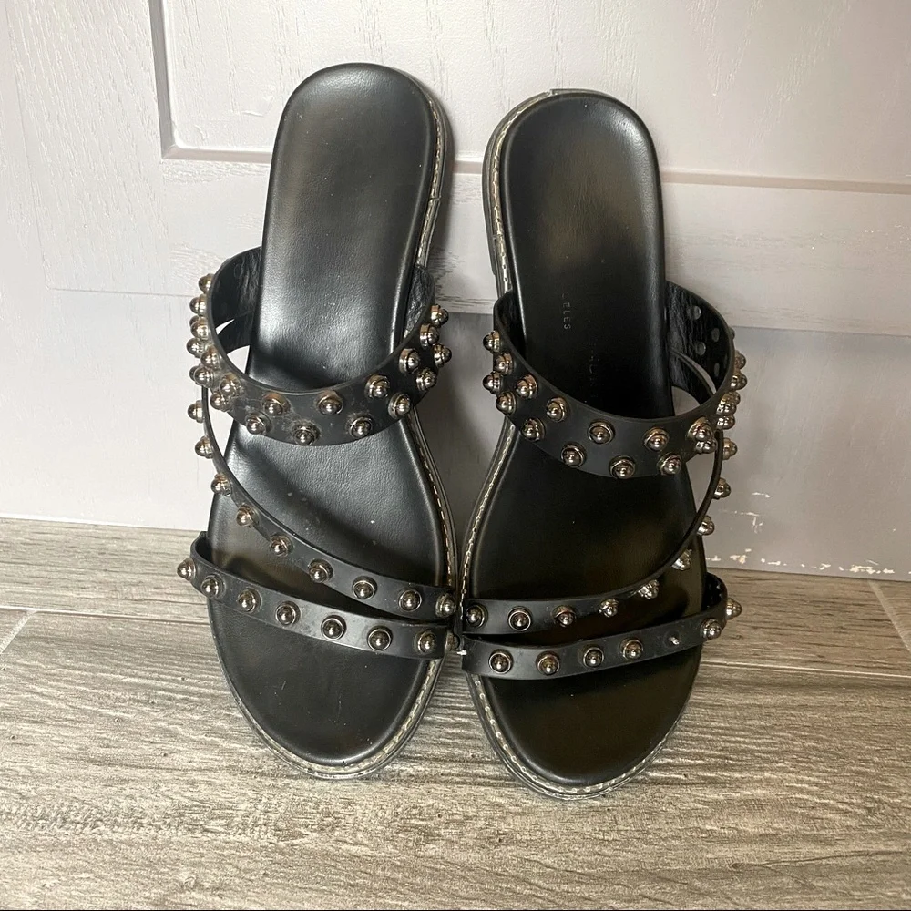 Black leather sandals with spikes